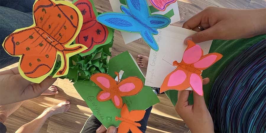 Pop up butterflies art activity with children and adults in Maya Learning Space, taken on March 2026
